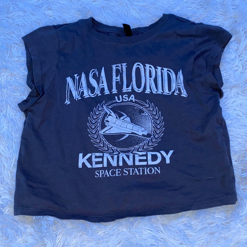 Grey and white NASA shirt.